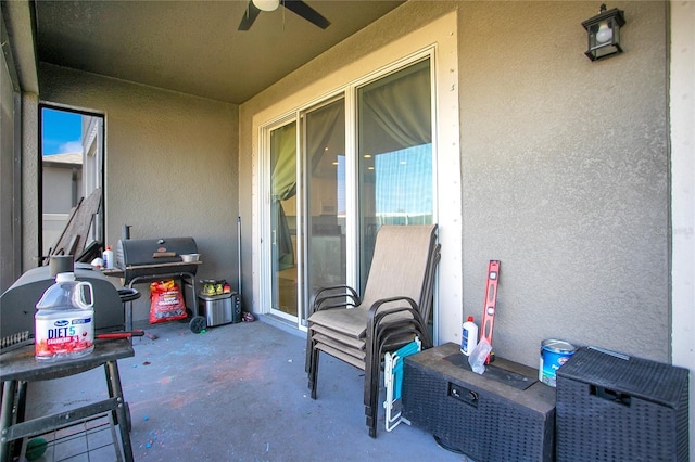 view of patio / terrace featuring a grill and a ceiling fan