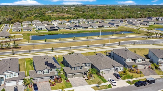 bird's eye view featuring a residential view and a water view