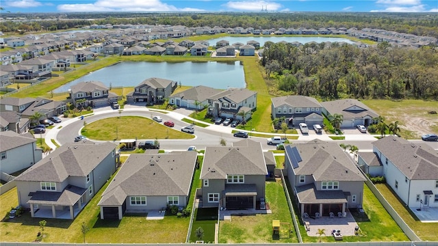 aerial view with a residential view and a water view