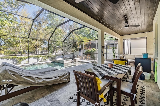 view of patio with a pool with connected hot tub, ceiling fan, outdoor dining area, an outdoor hangout area, and a lanai