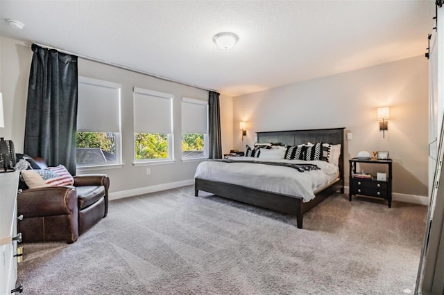 carpeted bedroom with baseboards