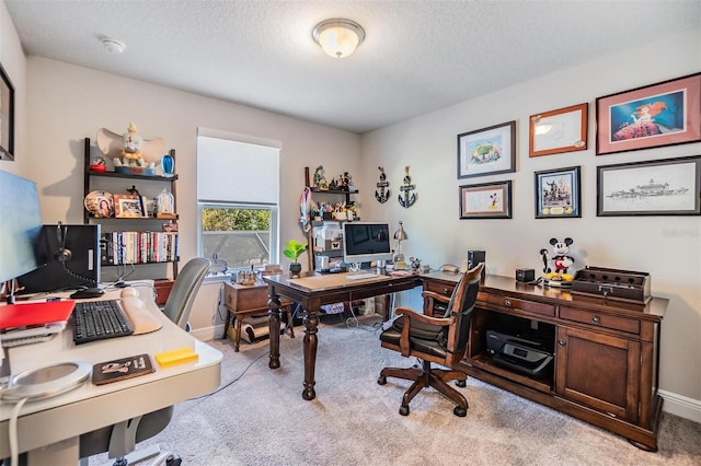 carpeted office space featuring baseboards and a textured ceiling