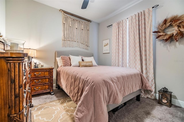 carpeted bedroom with baseboards and a ceiling fan