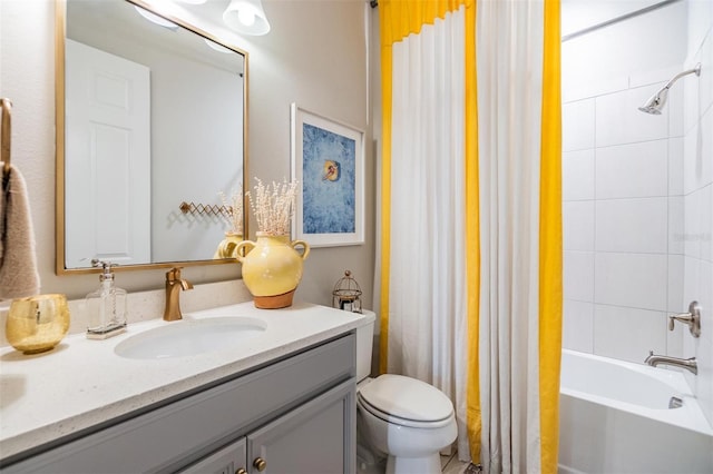 bathroom featuring toilet, vanity, and shower / tub combo