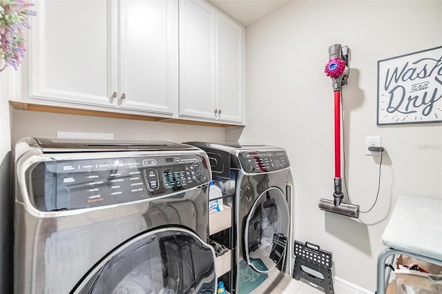 laundry area featuring cabinet space and separate washer and dryer