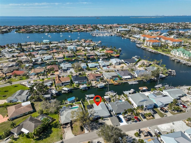 birds eye view of property featuring a residential view and a water view