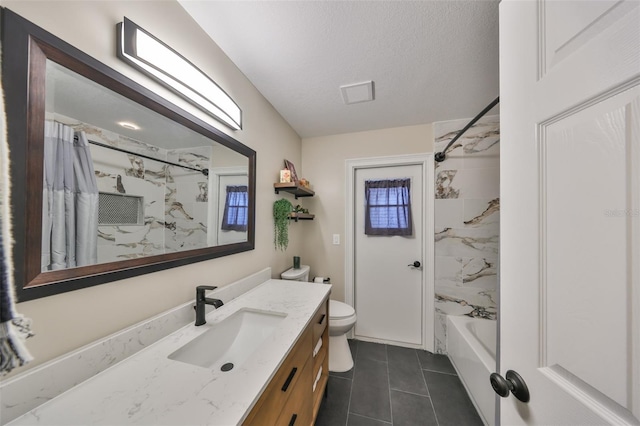 bathroom with vanity, tile patterned flooring, shower / bath combo with shower curtain, a textured ceiling, and toilet