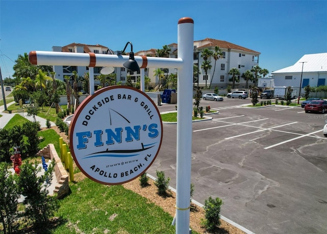 community sign with uncovered parking