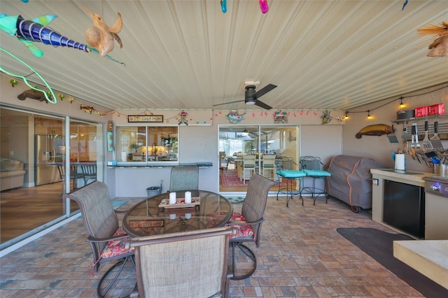 view of patio / terrace featuring outdoor dining area and ceiling fan