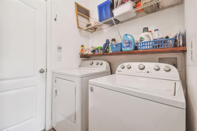 clothes washing area with laundry area and washing machine and clothes dryer