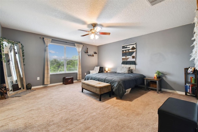 bedroom with ceiling fan, carpet, and baseboards