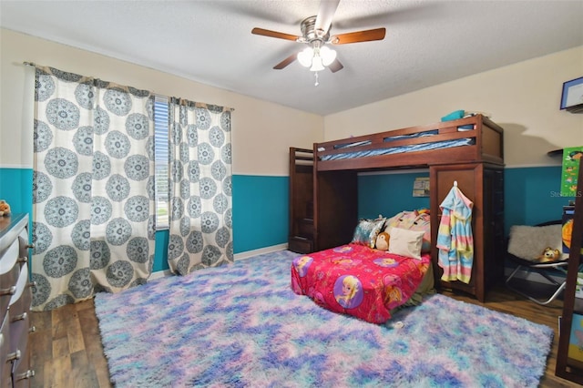 bedroom featuring wood finished floors and a ceiling fan