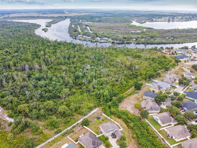 birds eye view of property featuring a water view and a residential view