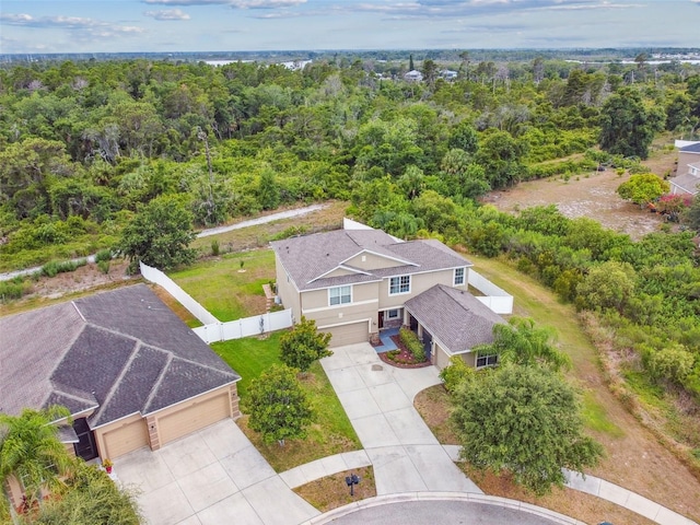 drone / aerial view featuring a forest view