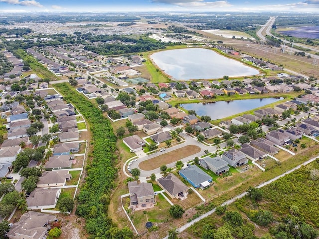 aerial view featuring a residential view and a water view