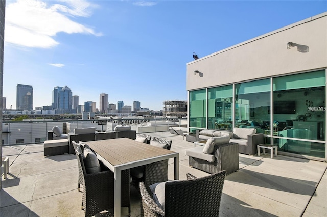 view of patio with a view of city and outdoor lounge area