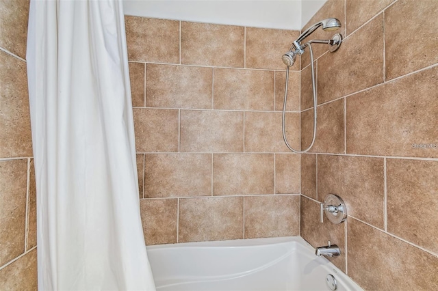 bathroom with shower / bathtub combination with curtain