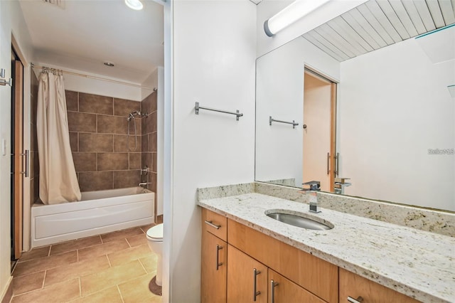 full bathroom with vanity, tile patterned flooring, shower / bath combo with shower curtain, and toilet