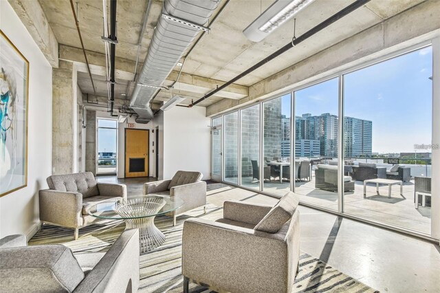 interior space featuring concrete floors and a city view