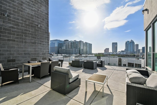 view of patio / terrace with an outdoor hangout area and a city view