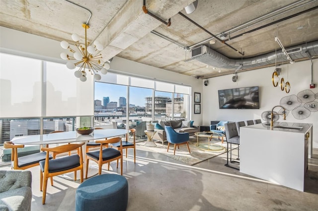 dining room with concrete flooring, visible vents, and a notable chandelier