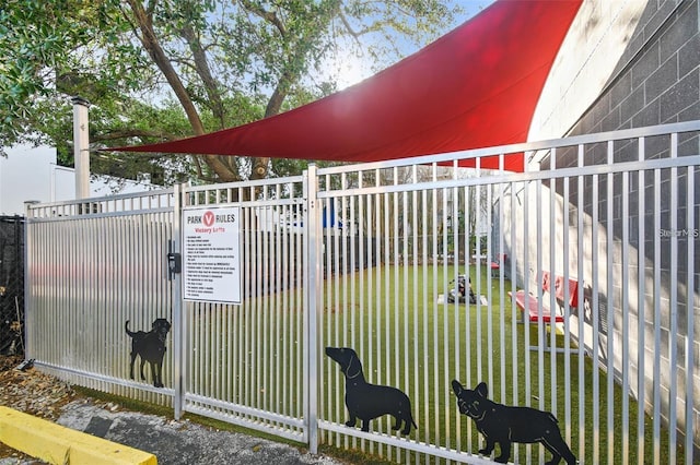 view of gate featuring fence