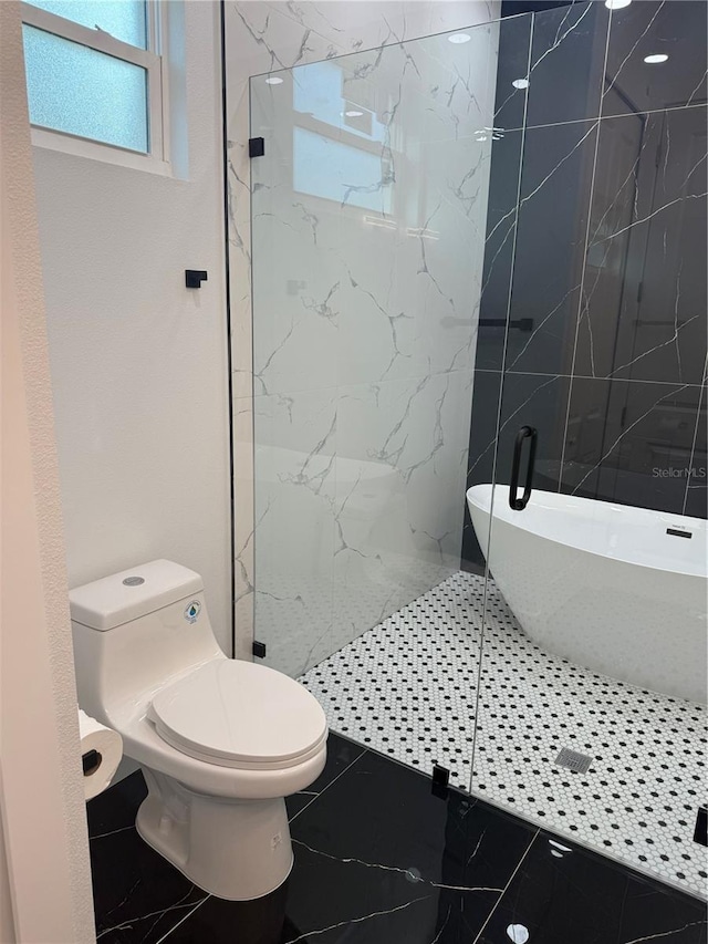 bathroom with a marble finish shower, marble finish floor, and toilet