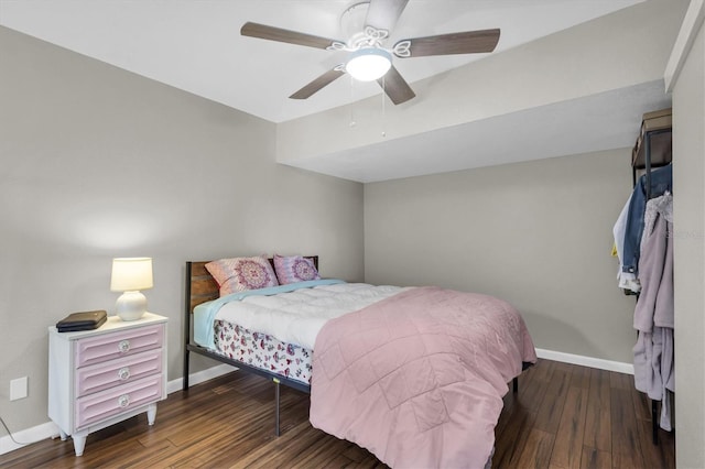 bedroom featuring ceiling fan, wood finished floors, and baseboards