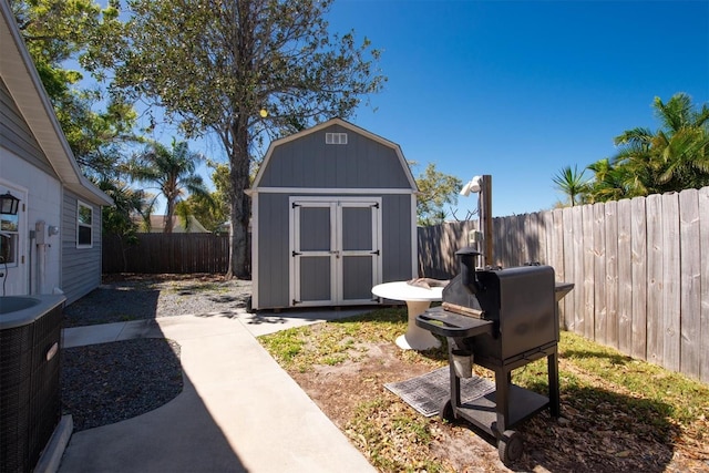 view of shed with a fenced backyard and central AC