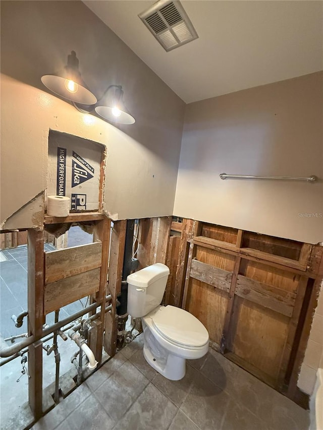 bathroom featuring toilet and visible vents