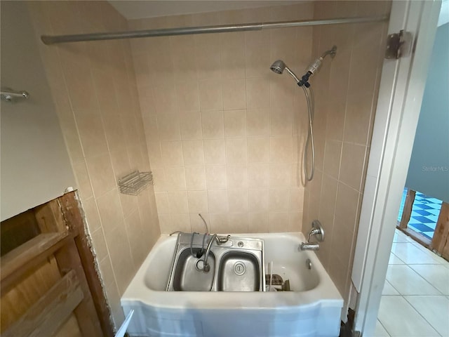 full bath featuring  shower combination and tile patterned flooring