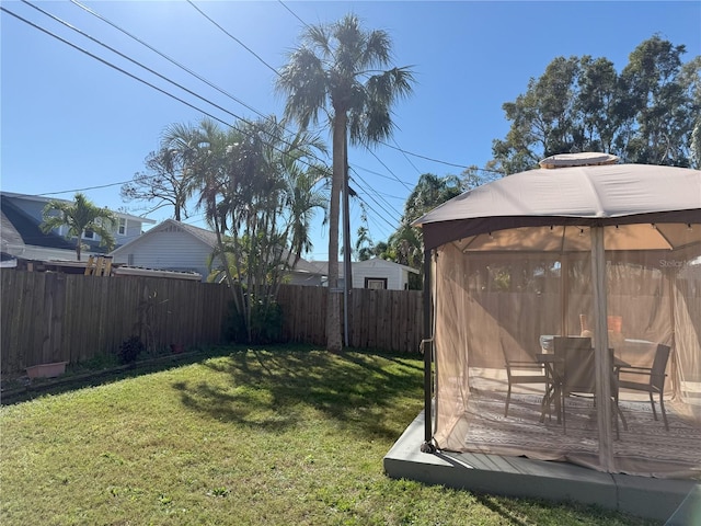 view of yard with a fenced backyard and a gazebo