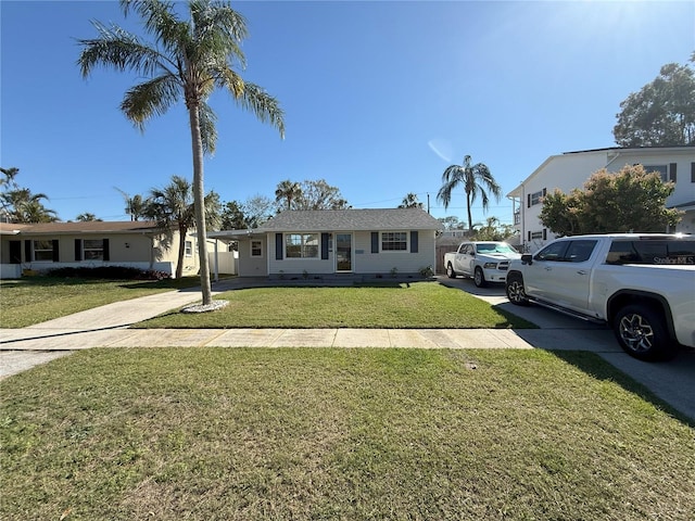 ranch-style home with a front lawn