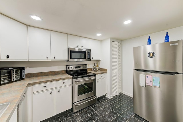 kitchen featuring appliances with stainless steel finishes, recessed lighting, light countertops, and white cabinetry