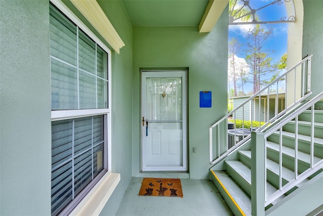 view of exterior entry with stucco siding