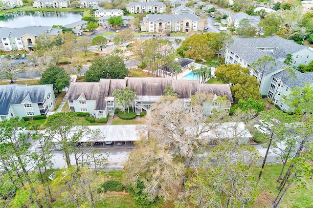 bird's eye view with a water view and a residential view