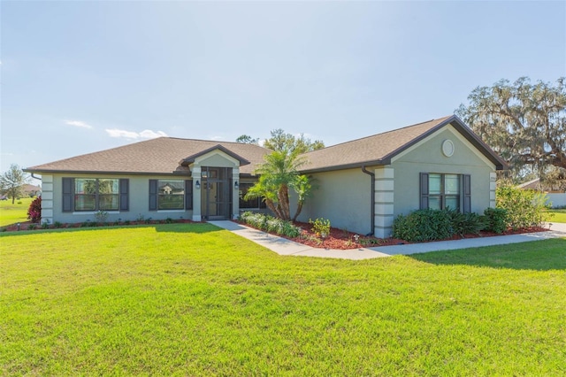 single story home featuring a front lawn and stucco siding