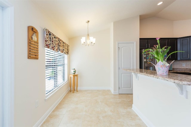 hall with light tile patterned floors, lofted ceiling, recessed lighting, a chandelier, and baseboards