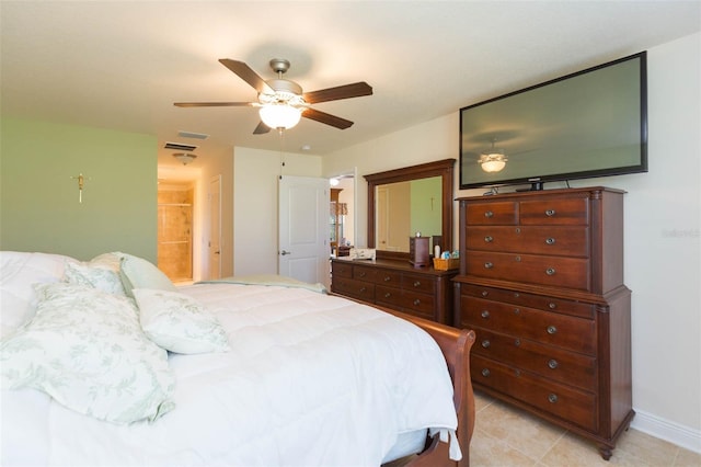 bedroom featuring ceiling fan, light tile patterned flooring, visible vents, and baseboards