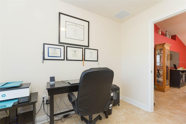 office space with light tile patterned flooring, visible vents, and baseboards