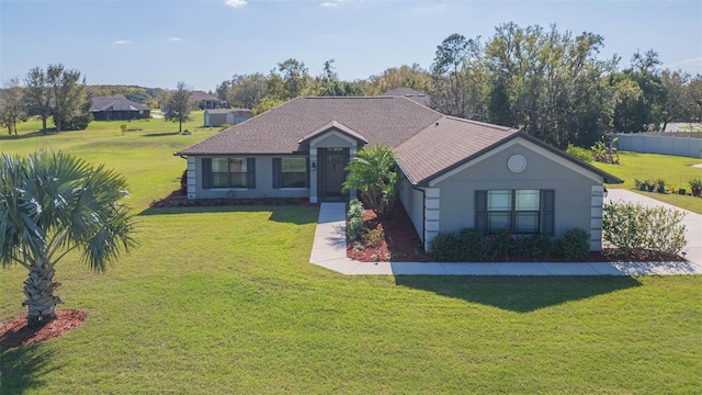 ranch-style home featuring fence, a front lawn, and stucco siding