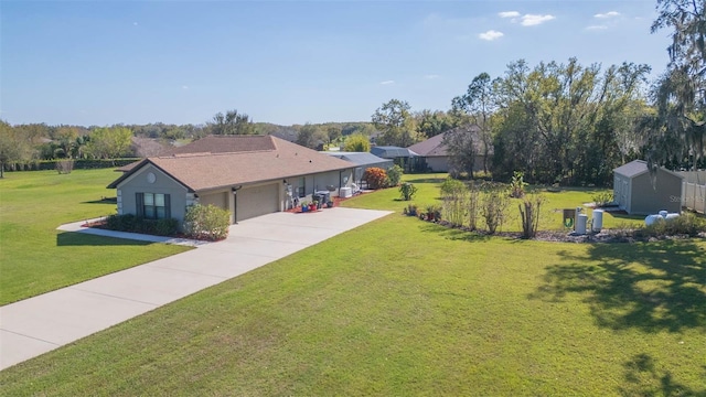 view of front of property with concrete driveway, a front lawn, and an attached garage