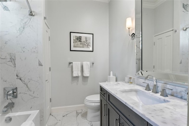 bathroom with baseboards, a bathing tub, toilet, vanity, and marble finish floor