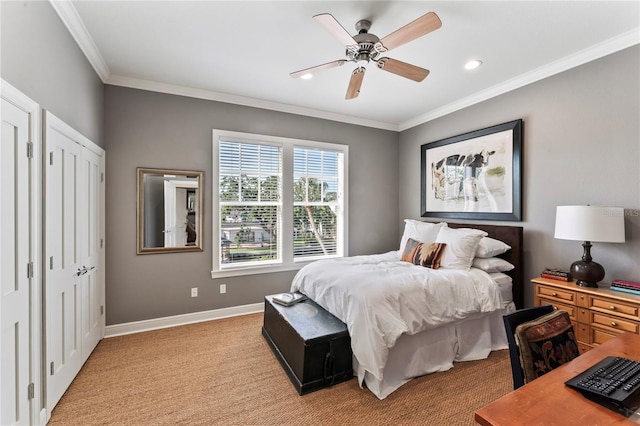 bedroom featuring baseboards, two closets, ornamental molding, a ceiling fan, and light colored carpet