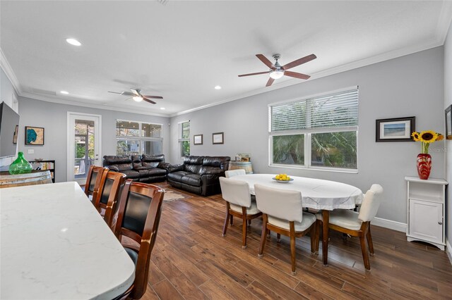 dining space with baseboards, dark wood finished floors, recessed lighting, ceiling fan, and ornamental molding