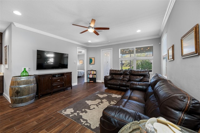 living room with dark wood-type flooring, baseboards, and ornamental molding