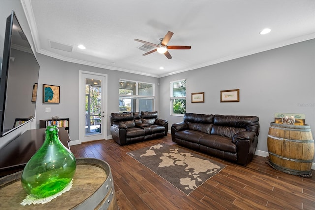 living room featuring wood finished floors and crown molding