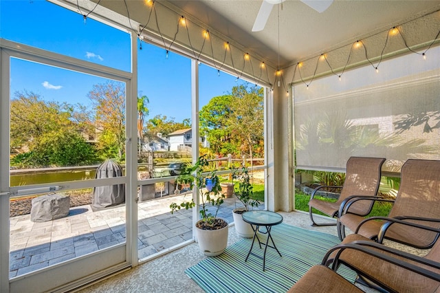 sunroom with a ceiling fan