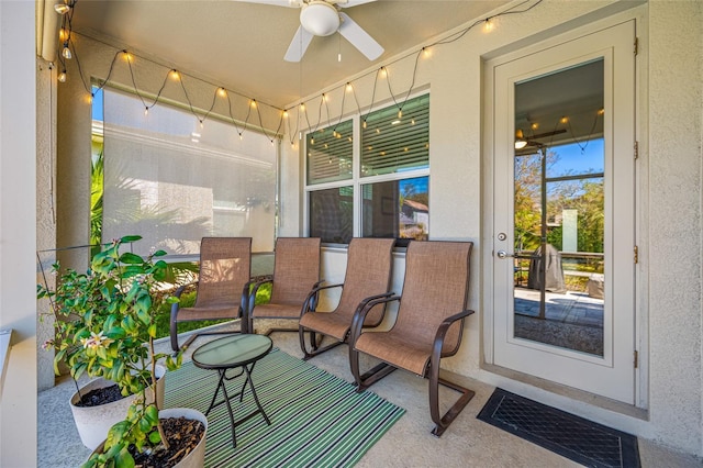 sunroom / solarium featuring visible vents and a ceiling fan