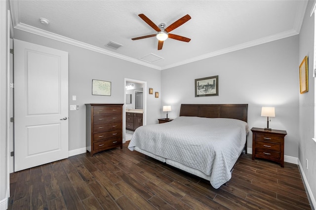 bedroom featuring attic access, wood finished floors, visible vents, and baseboards